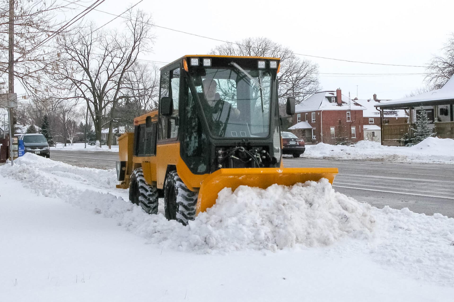 trackless vehicles mt6 tractor machine and sidewalk plow plowing snow