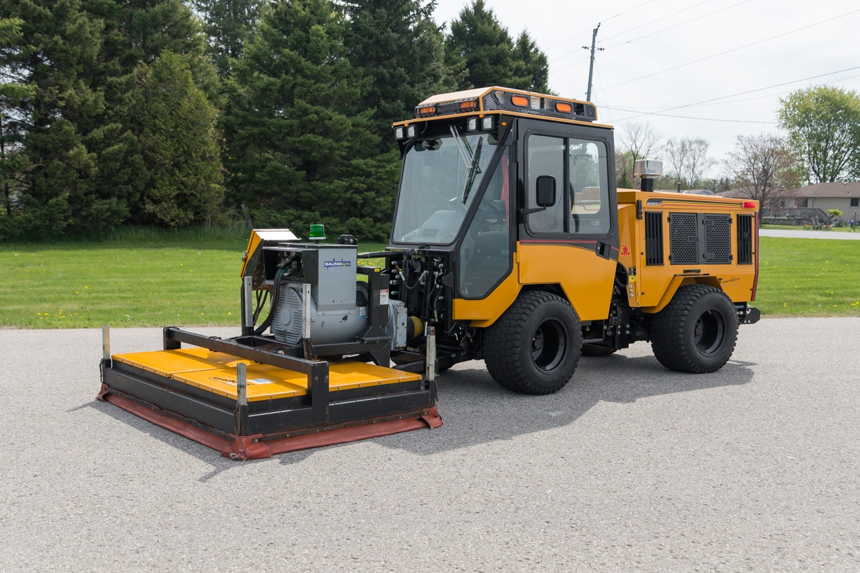 trackless vehicles infrared asphalt heater attachment on sidewalk tractor side view