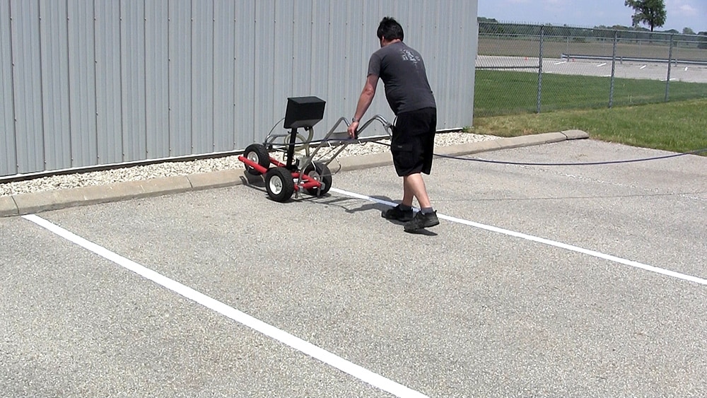 snow on ground after trackless vehicles 5-position folding v-plow attachment on sidewalk tractor