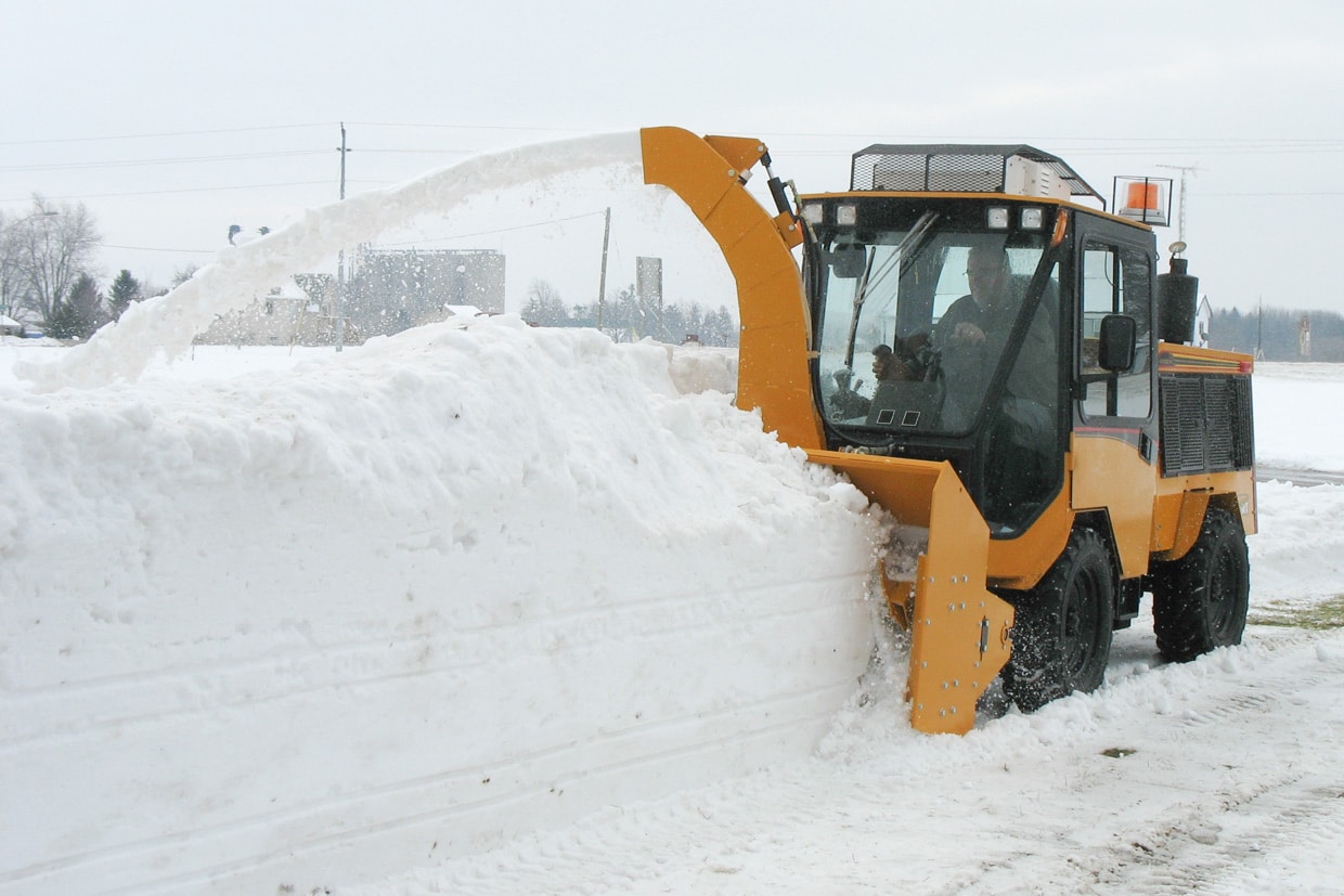 trackless vehicles twin auger snowblower in snow